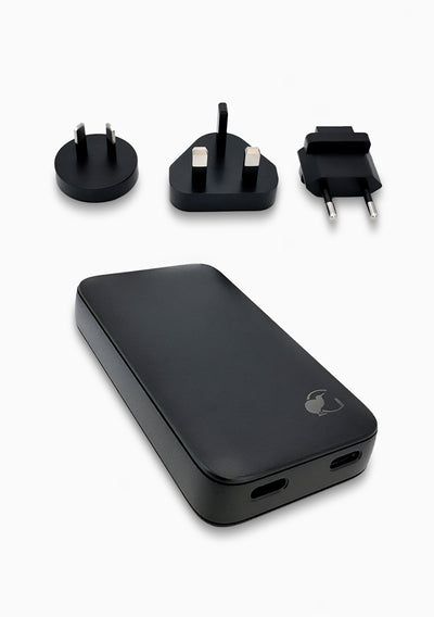 Alt text:
Black portable charger in beige travel pouch with adapters #color_black
