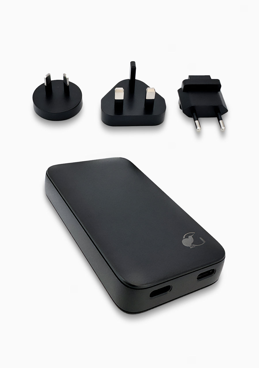 Alt text:
Black portable charger in beige travel pouch with adapters #color_black
